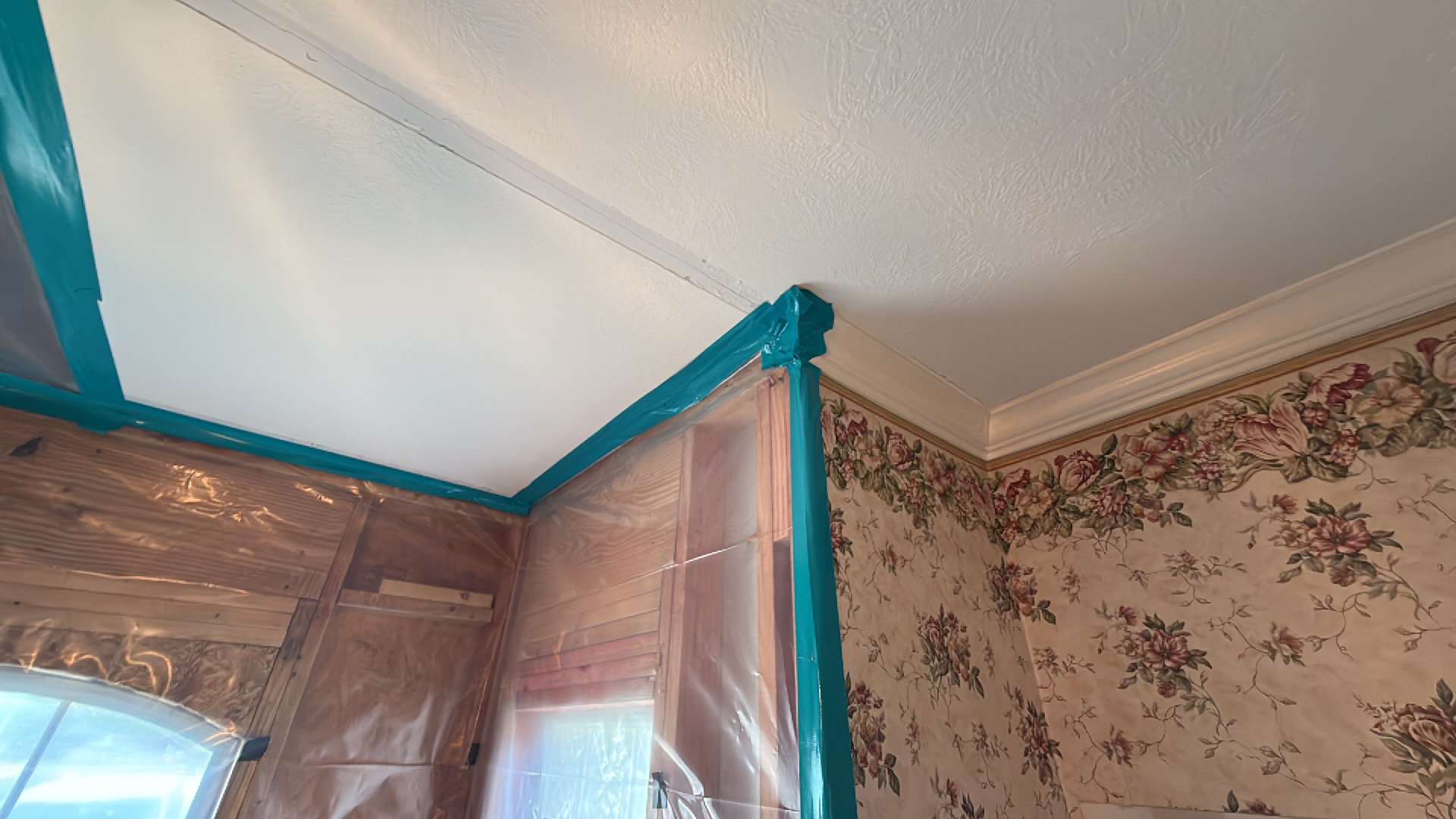 Setting up a low-profile centrifugal air mover to dry out a water damaged closet corner.