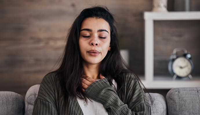 Woman experiencing breathing problem