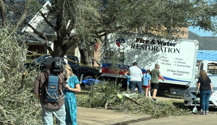 Fire Reconstruction Inc. van in hurricane damaged area
